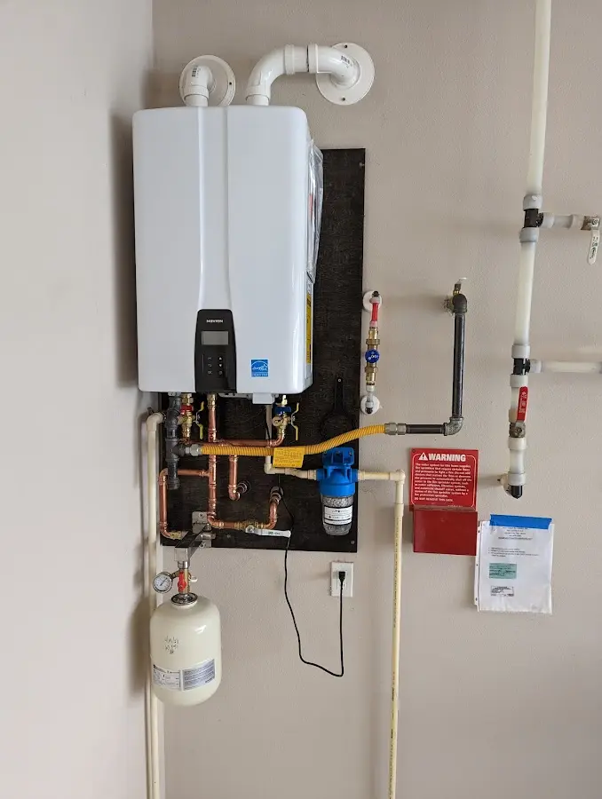 Professional plumber installing copper piping in a South Toms River home